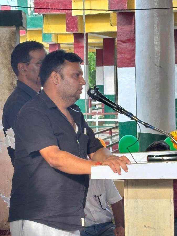 A participant speaking at a debate podium