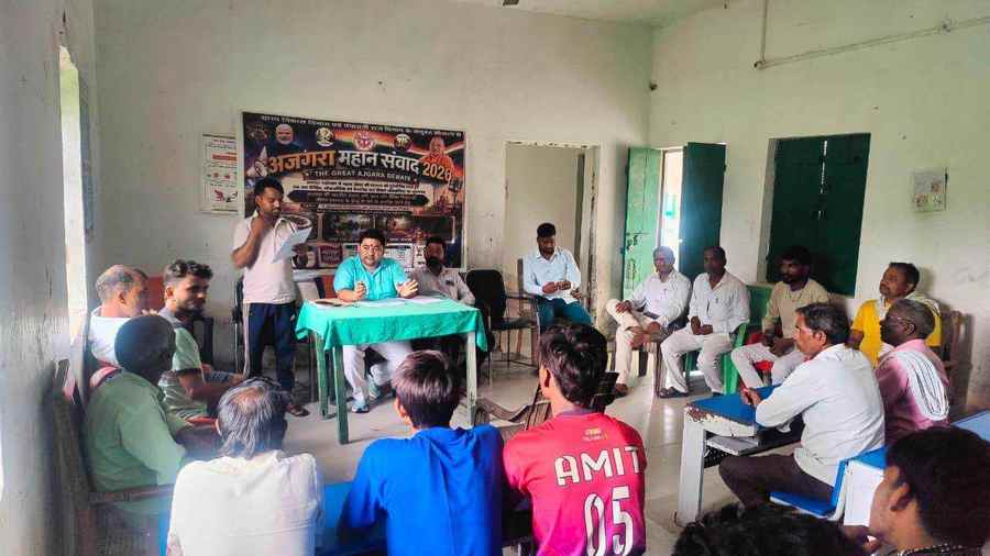 A debate taking place in a modest community room